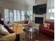 Spacious living room with a fireplace and comfortable seating at 7272 E Gainey Ranch Rd # 121, Scottsdale, AZ 85258