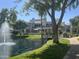 Peaceful water view near a walking path with building exterior in the background at 7272 E Gainey Ranch Rd # 121, Scottsdale, AZ 85258