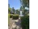 Picturesque pond featuring a fountain and lush landscaping creating a serene atmosphere at 7272 E Gainey Ranch Rd # 121, Scottsdale, AZ 85258