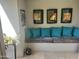 Cozy sitting area with decorative pillows, artwork and neutral tile flooring creating a warm, inviting space at 7272 E Gainey Ranch Rd # 121, Scottsdale, AZ 85258
