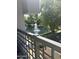 Balcony view of beautiful water feature with fountain overlooking the lush landscape surrounding this property at 7272 E Gainey Ranch Rd # 121, Scottsdale, AZ 85258