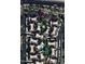 An aerial view of Sienna Condominiums showcasing manicured landscaping, a swimming pool, tennis court and ample parking at 7575 E Indian Bend Rd # 2002, Scottsdale, AZ 85250