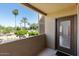 Inviting balcony with views of palm trees and desert landscape, offering a serene outdoor space at 7575 E Indian Bend Rd # 2002, Scottsdale, AZ 85250