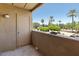 Private balcony with a storage closet and railing offering views of the surrounding community at 7575 E Indian Bend Rd # 2002, Scottsdale, AZ 85250