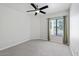 Spacious bedroom with a large window and plush gray carpet at 7575 E Indian Bend Rd # 2002, Scottsdale, AZ 85250