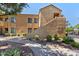 Exterior view of stucco home with tile roof and desert landscaping at 7575 E Indian Bend Rd # 2002, Scottsdale, AZ 85250