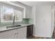 Bright kitchen with white cabinets, stainless steel appliances, and tile backsplash at 7575 E Indian Bend Rd # 2002, Scottsdale, AZ 85250