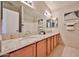 Bathroom featuring double sinks, granite countertop, and shower-tub combination at 7633 W Kristal Way, Glendale, AZ 85308