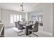 Dining room filled with natural light, stylish furnishings, and an open view to the living area at 7633 W Kristal Way, Glendale, AZ 85308
