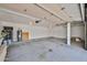 Spacious two car garage with a water heater and garage door opening mechanism at 7633 W Kristal Way, Glendale, AZ 85308