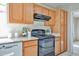 Updated kitchen featuring wood cabinets, stainless steel appliances, and granite countertops at 7633 W Kristal Way, Glendale, AZ 85308