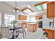 Eat-in kitchen featuring tile flooring, center island, wood cabinets, and stainless steel appliances at 7633 W Kristal Way, Glendale, AZ 85308