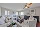 Inviting living room showcasing hardwood floors, shuttered windows, and stylish furniture, enhancing comfort at 7633 W Kristal Way, Glendale, AZ 85308