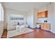Cozy sitting room features modern decor, built-in cabinets, and natural light at 7633 W Kristal Way, Glendale, AZ 85308