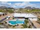 Beautiful aerial view of backyard pool and patio of home set against mountains at 9224 N 126Th St, Scottsdale, AZ 85259
