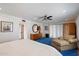 Spacious bedroom showcasing blue carpet, natural light, and an armoire for storage at 9224 N 126Th St, Scottsdale, AZ 85259
