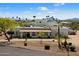 Stunning aerial view of a luxurious estate with tile roof surrounded by desert landscape and palm trees at 9224 N 126Th St, Scottsdale, AZ 85259