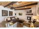 Inviting living room with ceiling beams, fireplace, and comfortable furnishings at 9224 N 126Th St, Scottsdale, AZ 85259