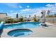 Sparkling pool and spa in backyard with lounge chairs and clear blue skies above at 9224 N 126Th St, Scottsdale, AZ 85259