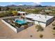 A beautiful pool area with desert landscaping and a diving board, all surrounded by a privacy fence with mountain views at 9224 N 126Th St, Scottsdale, AZ 85259