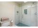Sleek glass shower featuring subway tile and niche shelving for storage at 9224 N 126Th St, Scottsdale, AZ 85259