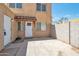 Private backyard featuring block fence, door with awning, and concrete patio at 948 S Alma School Rd # 13, Mesa, AZ 85210