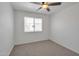 Bedroom with neutral carpet, a window, and fresh, white paint at 948 S Alma School Rd # 13, Mesa, AZ 85210