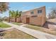 Exterior of a home with a walkway, block fence, and desert landscaping at 948 S Alma School Rd # 13, Mesa, AZ 85210