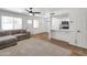 The kitchen flows into the living area, which has wood flooring and lots of natural light at 948 S Alma School Rd # 13, Mesa, AZ 85210