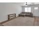 Living room with wood-look flooring, sliding glass window, and comfortable seating at 948 S Alma School Rd # 13, Mesa, AZ 85210