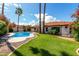 This backyard has a private pool, grass lawn and beautiful landscaping at 9629 N 83Rd Way, Scottsdale, AZ 85258