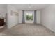 Bright bedroom featuring neutral walls, plush carpeting, and a large window with views of the outdoors at 9629 N 83Rd Way, Scottsdale, AZ 85258