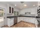 Bright kitchen features white cabinetry, stainless steel appliances, granite countertops, and lots of natural light at 9629 N 83Rd Way, Scottsdale, AZ 85258