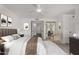 A serene main bedroom with a large bed, neutral tones, and a mirrored closet door at 9629 N 83Rd Way, Scottsdale, AZ 85258