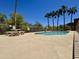 Outdoor pool area with a diving restriction sign and a picnic table under a bright blue sky at 16344 E Arrow Dr # B1, Fountain Hills, AZ 85268