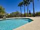 Inviting pool area with sparkling blue water and tall palm trees under a clear blue sky at 16344 E Arrow Dr # B1, Fountain Hills, AZ 85268