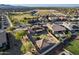 Expansive aerial view of a community home featuring a spacious backyard with a trampoline and desert landscaping at 17451 W Hadley St, Goodyear, AZ 85338