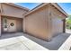 Charming home exterior with a two-car garage, lovely front door with wreath, and well-maintained landscaping at 17451 W Hadley St, Goodyear, AZ 85338