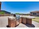 Outdoor kitchen featuring a built-in grill on a paved patio with a view of the yard at 17451 W Hadley St, Goodyear, AZ 85338