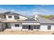 Aerial backyard view featuring solar panels on the roof, an enclosed sunroom, and desert landscaping at 3215 N 83Rd St, Mesa, AZ 85207