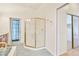 Bathroom featuring a glass-enclosed shower, vanity with sink and a window providing natural light and ventilation at 3215 N 83Rd St, Mesa, AZ 85207