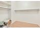 Walk-in closet with ample shelving, and hanging space providing practical storage solutions at 3215 N 83Rd St, Mesa, AZ 85207