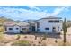 Desert home featuring white stucco, a tile roof, and arid landscaping with mature cactus at 3215 N 83Rd St, Mesa, AZ 85207