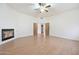Spacious living room boasting a fireplace, wood floors, neutral walls, and open doorway providing versatile layout options at 3215 N 83Rd St, Mesa, AZ 85207