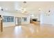 Spacious living area with hardwood floors and a view into the adjacent kitchen area at 3215 N 83Rd St, Mesa, AZ 85207