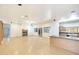 Spacious living area featuring hardwood floors, a corner fireplace and a breakfast bar at 3215 N 83Rd St, Mesa, AZ 85207