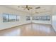 Bright living room featuring hardwood floors, white walls, and large windows offering great views at 3215 N 83Rd St, Mesa, AZ 85207