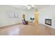 Bright living room featuring a fireplace, window, wood floors and neutral paint creating a modern and spacious atmosphere at 3215 N 83Rd St, Mesa, AZ 85207