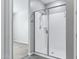 Modern bathroom showcasing a glass enclosed shower with bright, white tile at 35733 W Santa Monica Ave, Maricopa, AZ 85138
