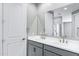 Bathroom with double sinks, cabinet storage, and a mirror at 35733 W Santa Monica Ave, Maricopa, AZ 85138